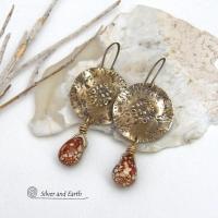 These handcrafted gold brass earrings have a modern, organic earthy style and are accented with natural brown spotted jasper gemstones. Bold, unique and one-of-a-kind - they make a striking statement with a modern edgy vibe. Perfect for women that love unique artisan handcrafted jewelry, earthy hammered textures and natural stones. Handmade in the USA by Silver and Earth Jewelry.