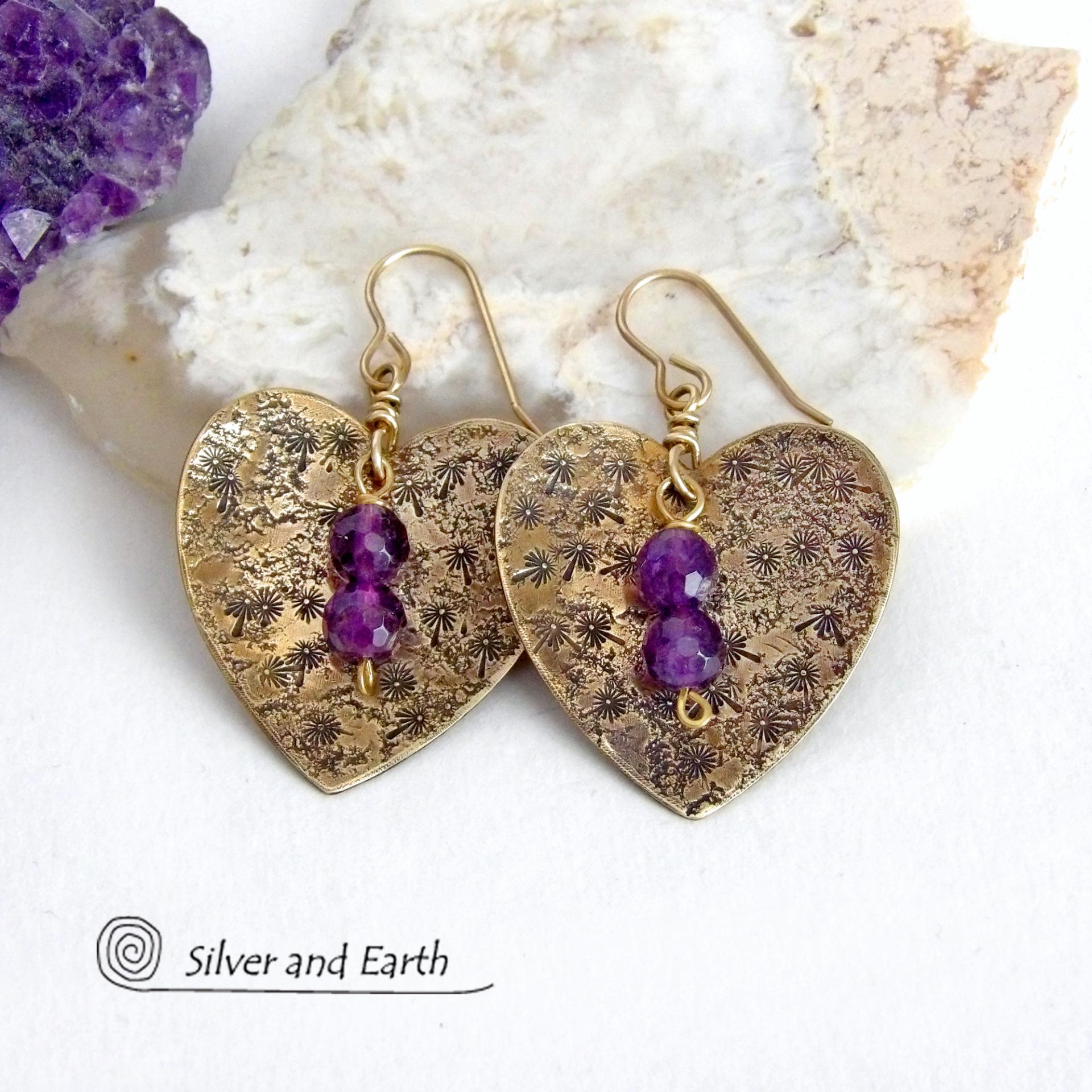 These gold brass heart earrings have a romantic, feminine charm and will make a great gift for someone special. They feature handcrafted gold brass hearts with a hand stamped texture accented with faceted amethyst gemstones dangling in front. The perfect gift to say "I love you" on Valentine's Day or any day! They'll also make a great gift for someone born in February - amethyst is the birthstone for this month.  Makes a great gift for couples celebrating their 21st wedding anniversary.