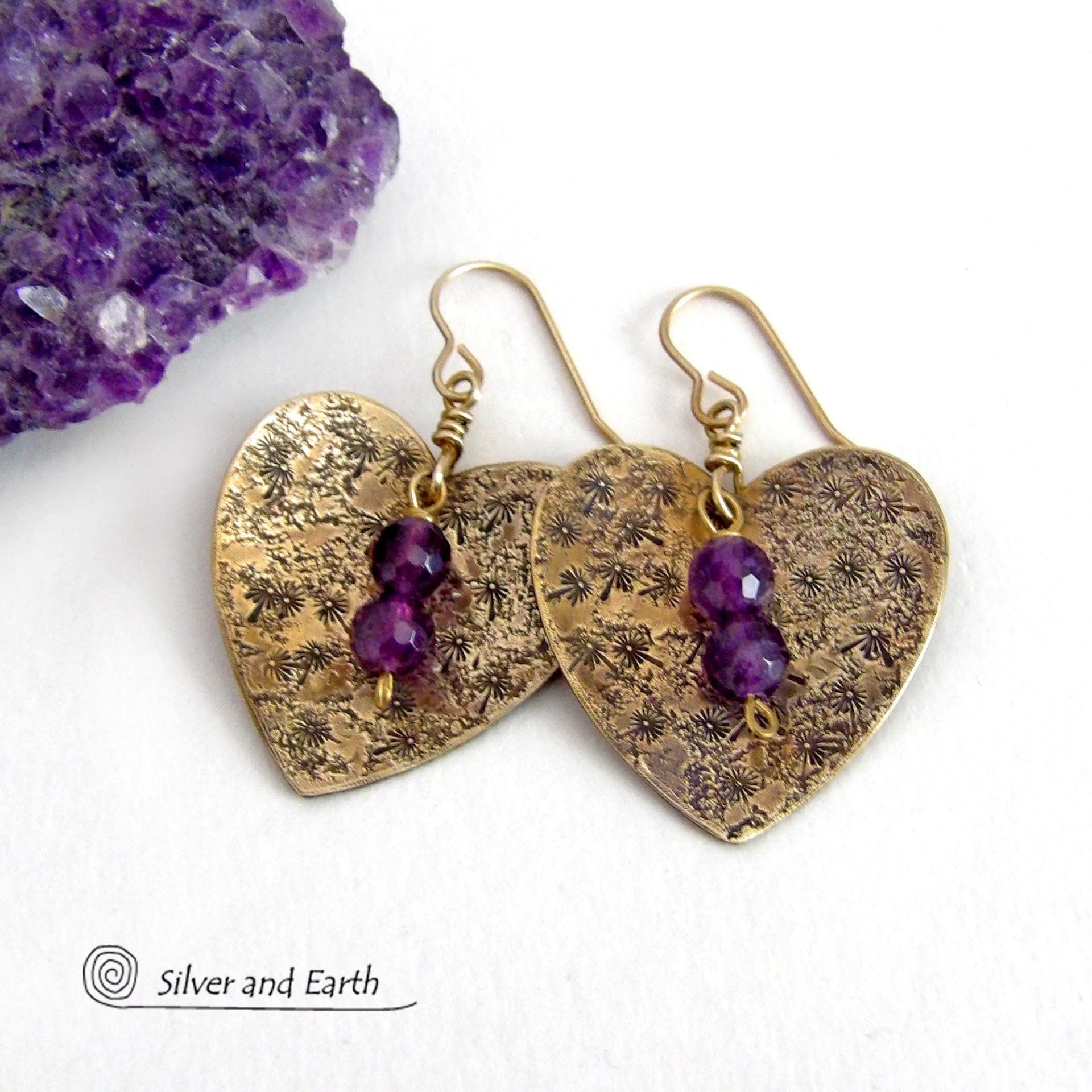 These gold brass heart earrings have a romantic, feminine charm and will make a great gift for someone special. They feature handcrafted gold brass hearts with a hand stamped texture accented with faceted amethyst gemstones dangling in front. The perfect gift to say "I love you" on Valentine's Day or any day! They'll also make a great gift for someone born in February - amethyst is the birthstone for this month.  Makes a great gift for couples celebrating their 21st wedding anniversary.