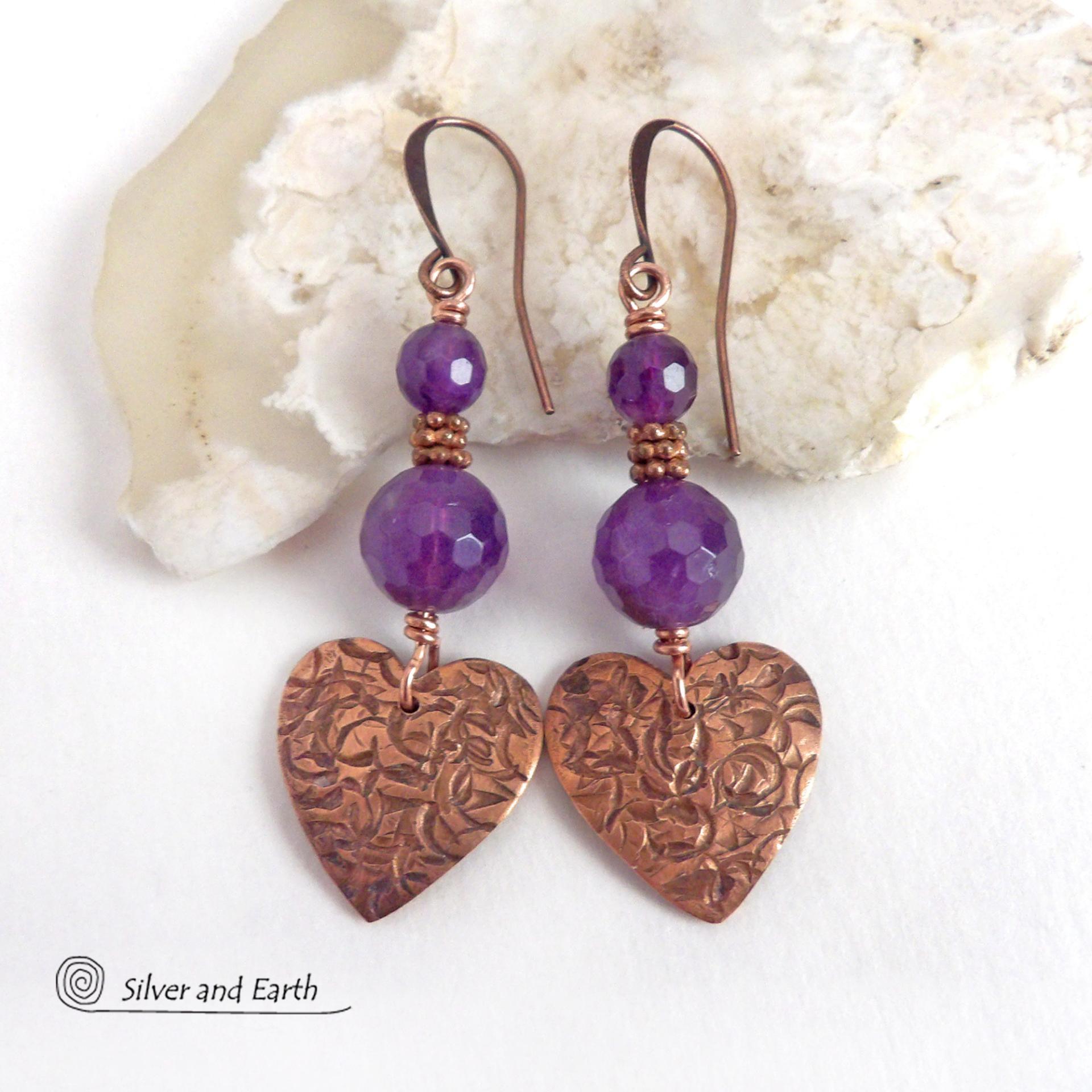 These handcrafted copper heart dangle earrings have a hand stamped texture and are accented with genuine purple amethyst gemstones with a faceted finish and tiny copper beads. Modern, classic and elegant - the style is always in fashion. The perfect gift for someone special on Valentine's Day or any day! They'll also make a great gift for someone with a February birthday or 6th anniversary - amethyst is the gemstone for either occasion. Or a 7th anniversary gift - copper is the traditional theme for this. 