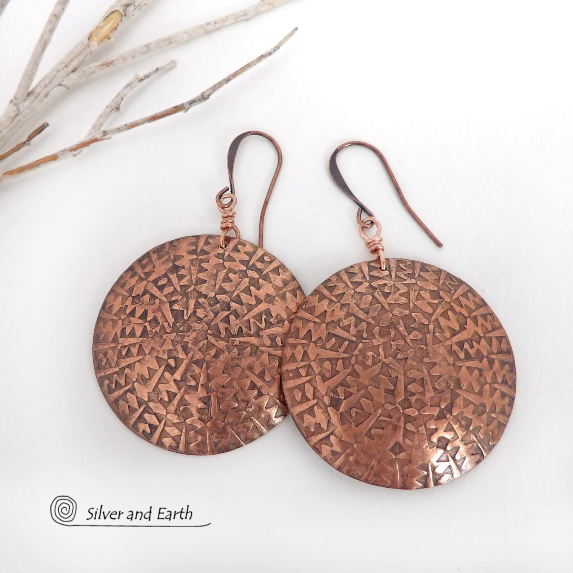 Big, bold and dramatic - these handmade copper earrings will make a statement. Unique and versatile, they'll look great with all wardrobe styles. They feature large copper circles with an intricate hand stamped texture and oxidized finish.