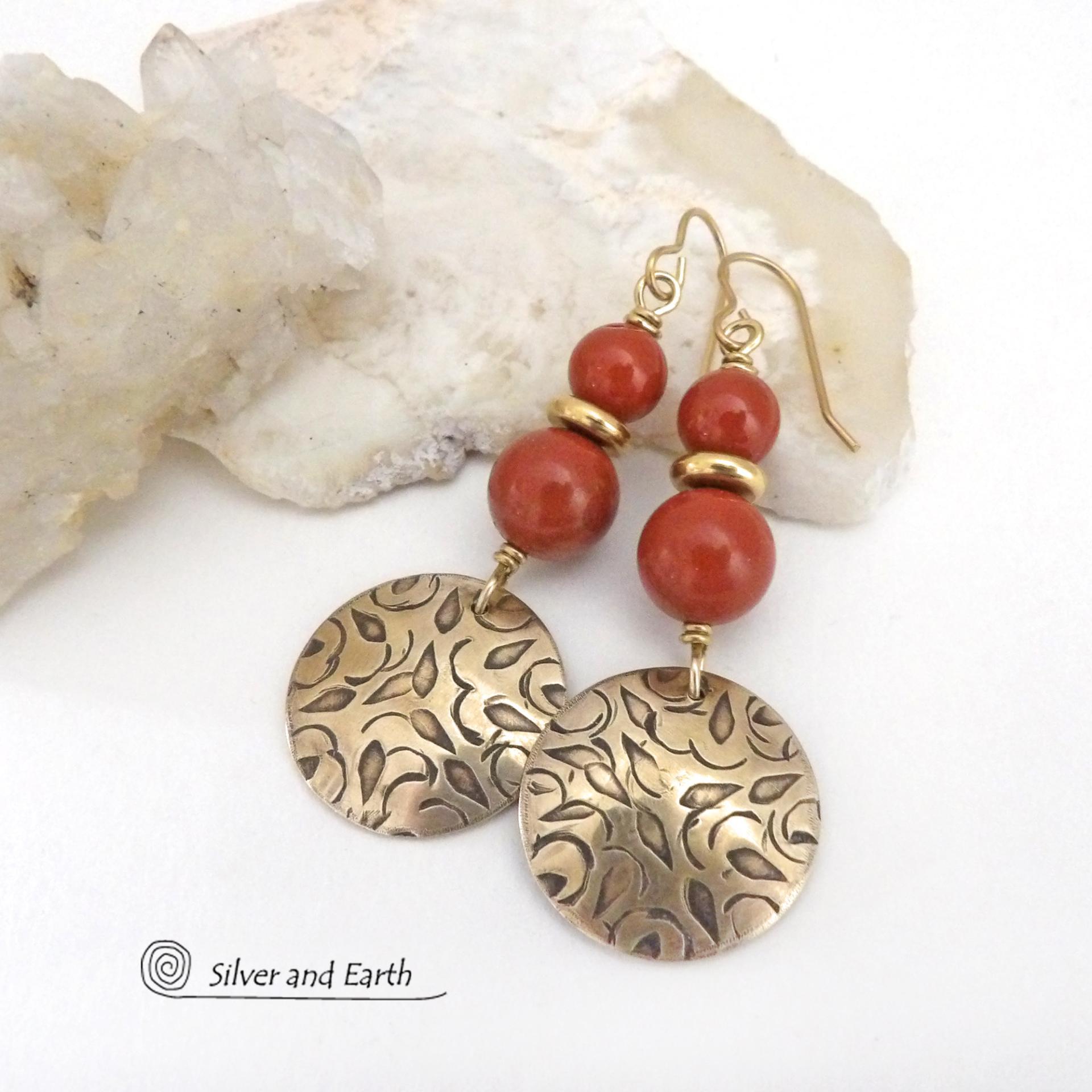 These handcrafted earrings have an elegant, modern chic style that coordinates beautifully with all wardrobe types -- dressed up or down. They feature gold brass dangles with a hand stamped texture accented with a stack of red jasper gemstones and shiny brass beads. They'll make a great gift for a natural gemstone lover - or a nice addition to your own jewelry wardrobe. Handmade in the USA by Silver and Earth jewelry.
