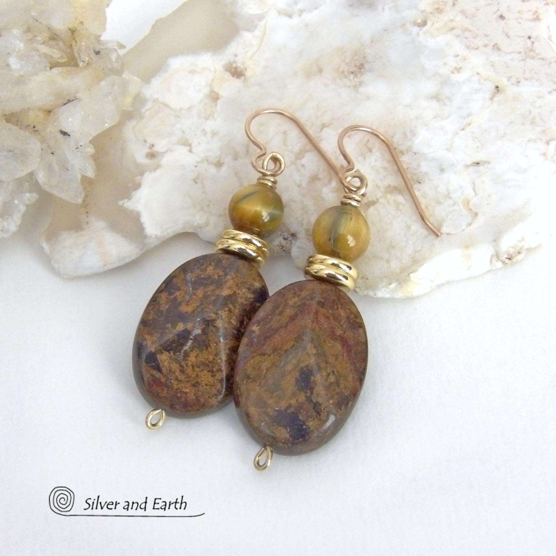 These handcrafted earrings feature natural bronzite gemstones with a faceted finish accented with golden tiger's eye gemstones and shiny brass beads. The bronzite stones have a beautiful chocolate brown hue with subtle *gold tone* metallic inclusions. Bronzite is a blend of several minerals which gives it a unique mottled appearance. They have a modern, earthy appeal and will make a great gift for a nature lover - or an interesting addition to your own jewelry wardrobe. Handmade in the USA by Silver and Ear