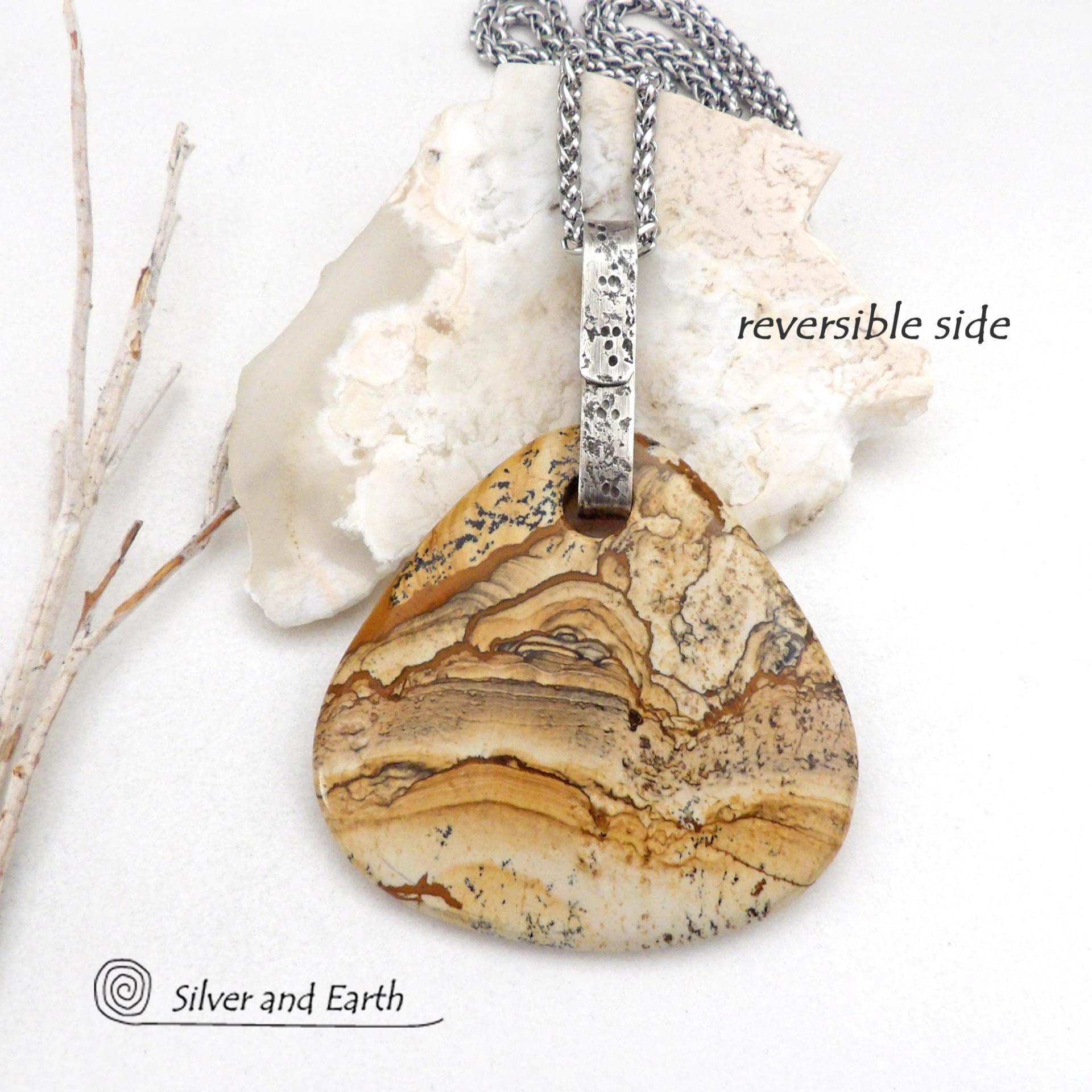 This one-of-a-kind necklace features a large stunning picture jasper stone accented with a handcrafted sterling silver bail. The stone has a beautiful natural pattern in various shades of brown, beige and gray. Big and bold, this necklace is a real statement piece - perfect for anyone that loves natural stones! 