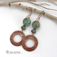  These handcrafted earrings feature round copper hoop dangles with a hand stamped texture accented with a stack of natural African turquoise stones and tiny copper beads. The stones have a pretty turquoise hue with an earthy natural black and brown matrix. These earrings have an earthy chic style with a modern bohemian flair that will coordinate beautifully with all wardrobe types. Handmade in the USA by Silver and Earth Jewelry.  Your choice of ear wires - copper or hypoallergenic niobium. 
