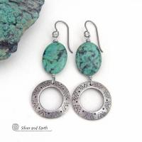 Unique and one-of-a-kind, these artisan handcrafted earrings feature natural African turquoise stones accented with silver tone pewter dangles with a hand stamped texture and oxidized finish. They have an earthy, modern style with a touch of southwestern flair. Coordinating necklace sold separately.