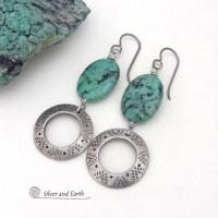 Unique and one-of-a-kind, these artisan handcrafted earrings feature natural African turquoise stones accented with silver tone pewter dangles with a hand stamped texture and oxidized finish. They have an earthy, modern style with a touch of southwestern flair. Coordinating necklace sold separately.