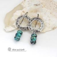 These handcrafted earrings feature oxidized silver pewter hoops with a rustic hammered and hand stamped texture accented with a stack of natural African turquoise stones. They have an earthy organic style with a modern, edgy vibe and are lightweight and comfortable to wear.