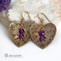 These gold brass heart earrings have a romantic, feminine charm and will make a great gift for someone special. They feature handcrafted gold brass hearts with a hand stamped texture accented with faceted amethyst gemstones dangling in front. The perfect gift to say "I love you" on Valentine's Day or any day! They'll also make a great gift for someone born in February - amethyst is the birthstone for this month.  Makes a great gift for couples celebrating their 21st wedding anniversary.