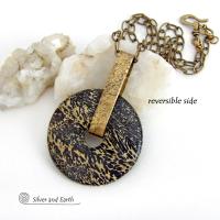 This one-of-a-kind pendant necklace features a stunning artistic jasper stone accented with a hand forged gold brass bail. This type of jasper is known for its intricate, natural patterns that resemble brushstrokes, landscapes, or abstract art. The stone in this piece has a natural bold dramatic pattern in hues of black and soft golden yellow with black streaks that resemble "feathery" dendrites. The design is modern and bold - yet classic and always in fashion. It can be worn by either a man or women. 