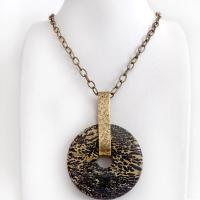 This one-of-a-kind pendant necklace features a stunning artistic jasper stone accented with a hand forged gold brass bail. This type of jasper is known for its intricate, natural patterns that resemble brushstrokes, landscapes, or abstract art. The stone in this piece has a natural bold dramatic pattern in hues of black and soft golden yellow with black streaks that resemble "feathery" dendrites. The design is modern and bold - yet classic and always in fashion. It can be worn by either a man or women. 