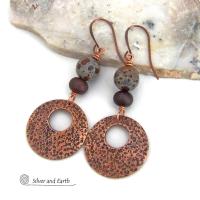 These handcrafted earrings feature round copper hoop dangles with a rustic hand stamped texture accented with natural spotted asteroid jasper and bronze glass beads. Unique and striking, they have an earthy organic flair that makes a bold statement. The jasper stones have a great natural spotted pattern with earthy shades of chocolate brown and grey. Your choice of ear wires - copper or hypoallergenic niobium.