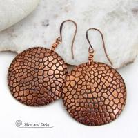 These handcrafted copper earrings have a beautifully detailed embossed cobblestone texture. Big and bold, they'll make a striking statement. Unique and versatile, they are lightweight and comfortable to wear and will look great with all wardrobe styles. Handmade in the USA by Silver and Earth Jewelry. Your choice of ear wire - copper or hypoallergenic niobium.
