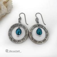 These handcrafted silver pewter hoop earrings have a hand stamped texture and are accented with beautiful blue freshwater pearls. They have a modern chic, classic style that is always in fashion and will coordinate beautifully with all wardrobe types. Makes a great gift for someone born in June. Pearl is the traditional gemstone for this month. Also makes a great wife gift for couples celebrating their 10th year of marriage. Pewter is the traditional metal for this occasion. Handmade in the USA by Silver an