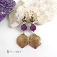 These handcrafted gold brass earrings have a hammered raw silk texture and are accented with natural purple amethyst gemstones, tiny brass beads and tulip flower-shaped brass beads. They have a modern elegant chic style that coordinates beautifully with all wardrobe types - dressed up or down. Makes a great gift for someone with a February birthday - amethyst is that month's birthstone. Handmade in the USA by Silver and Earth Jewelry. 