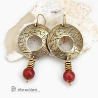These handcrafted gold brass earrings have a hand stamped texture and are accented with dangling burgundy jasper gemstones and brass beads. Big and bold, they have a modern chic vibe that makes a striking eye-catching statement. Handmade in the USA by Silver and Earth Jewelry. 