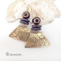 These handcrafted earrings have a mod, abstract hand stamped texture accented with brown and black Tibetan eye agate and black agate stones. Bold and unique - with an ethic tribal style - they'll make a striking statement. Makes a great gift for women that love bold statement jewelry. 