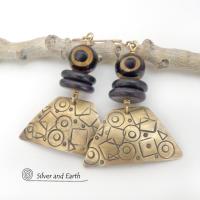 These handcrafted earrings have a mod, abstract hand stamped texture accented with brown and black Tibetan eye agate and black agate stones. Bold and unique - with an ethic tribal style - they'll make a striking statement.