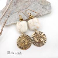 These gold brass dangle earrings have a unique hand textured design and are accented with creamy white magnesite stones. The stones have a natural matrix of golden-brown speckled inclusions and are topped off with tiny brass beads. I created the dangles out of solid gold brass sheet; and then created the texture which reminds me of the golden rays of the sun. The metal was oxidized to enhance the detail; then sealed with jeweler's wax to resist tarnishing. Handmade in the USA by Silver and Earth Jewelry.