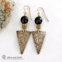These gold brass triangle earrings have a hand stamped texture and are accented with black onyx gemstones above a stack of tiny brass beads. The stones have a faceted finish which gives off a natural sparkle and shine. Lightweight and comfortable to wear - they have a modern chic contemporary style that coordinates well with all wardrobes types. Handmade in the USA by Silver and Earth Jewelry.