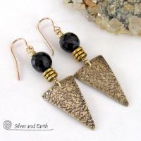 These gold brass triangle earrings have a hand stamped texture and are accented with black onyx gemstones above a stack of tiny brass beads. The stones have a faceted finish which gives off a natural sparkle and shine. Lightweight and comfortable to wear - they have a modern chic contemporary style that coordinates well with all wardrobes types. Handmade in the USA by Silver and Earth Jewelry.