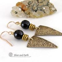 These gold brass triangle earrings have a hand stamped texture and are accented with black onyx gemstones above a stack of tiny brass beads. The stones have a faceted finish which gives off a natural sparkle and shine. Lightweight and comfortable to wear - they have a modern chic contemporary style that coordinates well with all wardrobes types. Handmade in the USA by Silver and Earth Jewelry.