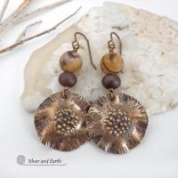 These earrings feature hand-forged bronze metal dangles accented with natural jasper stones and bronze glass beads. They have an earthy, modern boho feel that makes a striking statement. Perfect for women that love unique artisan handcrafted jewelry, earthy hammered textures and natural stones. Handmade in the USA by Silver and Earth Jewelry.