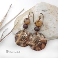 These earrings feature hand-forged bronze metal dangles accented with natural jasper stones and bronze glass beads. They have an earthy, modern boho feel that makes a striking statement. Perfect for women that love unique artisan handcrafted jewelry, earthy hammered textures and natural stones. Handmade in the USA by Silver and Earth Jewelry.
