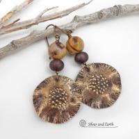 These earrings feature hand-forged bronze metal dangles accented with natural jasper stones and bronze glass beads. They have an earthy, modern boho feel that makes a striking statement. Perfect for women that love unique artisan handcrafted jewelry, earthy hammered textures and natural stones. Handmade in the USA by Silver and Earth Jewelry.