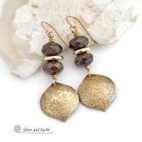 These handcrafted earrings feature gold brass dangles with a hammered organic texture accented with natural bronzite gemstones and shiny gold brass beads. The stones have a beautiful brown hue with a faceted finish which casts off a natural sparkle and shine. They have a modern chic style that coordinates beautifully with all wardrobe types - dressed up or down. A coordinating necklace is available that is sold separately.  Handmade in the USA by Silver and Earth Jewelry.