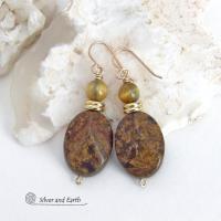 These handcrafted earrings feature natural bronzite gemstones with a faceted finish accented with golden tiger's eye gemstones and shiny brass beads. The bronzite stones have a beautiful chocolate brown hue with subtle *gold tone* metallic inclusions. Bronzite is a blend of several minerals which gives it a unique mottled appearance. They have a modern, earthy appeal and will make a great gift for a nature lover - or an interesting addition to your own jewelry wardrobe. Handmade in the USA by Silver and Ear