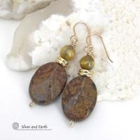 These handcrafted earrings feature natural bronzite gemstones with a faceted finish accented with golden tiger's eye gemstones and shiny brass beads. The bronzite stones have a beautiful chocolate brown hue with subtle *gold tone* metallic inclusions. Bronzite is a blend of several minerals which gives it a unique mottled appearance. They have a modern, earthy appeal and will make a great gift for a nature lover - or an interesting addition to your own jewelry wardrobe. Handmade in the USA by Silver and Ear