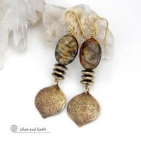 These handcrafted earrings feature gold brass dangles with a hammered organic texture accented with natural brown mica gemstones and faceted hematite stones with an electroplated champagne gold finish. The stones have a beautiful brown hue with undertones of shimmery gold and a faceted finish which casts off a natural sparkle and shine. They have a modern, chic and elegant style that coordinates beautifully with all wardrobe types - dressed up or down.