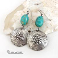 These handcrafted earrings feature natural turquoise nuggets accented with round sterling silver dangles with a rustic hammered and stamped texture. The stones are a gorgeous shade of turquoise with a subtle natural copper matrix. They have a modern, earthy organic style with a touch of southwestern flair.