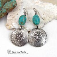 These handcrafted earrings feature natural turquoise nuggets accented with round sterling silver dangles with a rustic hammered and stamped texture. The stones are a gorgeous shade of turquoise with a subtle natural copper matrix. They have a modern, earthy organic style with a touch of southwestern flair. Handmade by Silver and Earth, a New Mexico True Certified Business.