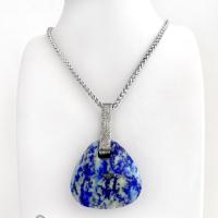 This one-of-a-kind necklace features a gorgeous, chunky and thick natural lapis lazuli gemstone accented with a handcrafted sterling silver bail with a lightly hammered organic texture. The stone is a beautiful shade of blue with white inclusions and a sprinkling of natural sparkly pyrite inclusions and a faceted finish. The stone is equally gorgeous on both sides, so I designed it to be reversible. (See all photos for alternate sides). Pendant comes on a 20" stainless steel chain necklace. 