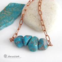 This chunky turquoise necklace features big, organically-shaped nuggets of genuine natural turquoise accented with a copper link chain. The turquoise is a stunning shade of blue - reminiscent of the lovely blue skies here in the American Southwest. Unique and one-of-a-kind, it will make a bold statement. Perfect for women that love bold unique jewelry made with natural stones. Handmade in the USA by Silver and Earth Jewelry. 