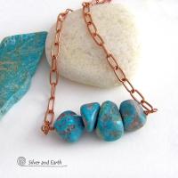 This chunky turquoise necklace features big, organically-shaped nuggets of genuine natural turquoise accented with a copper link chain. The turquoise is a stunning shade of blue - reminiscent of the lovely blue skies here in the American Southwest. Unique and one-of-a-kind, it will make a bold statement. Perfect for women that love bold unique jewelry made with natural stones. Handmade in the USA by Silver and Earth Jewelry. 