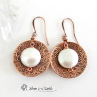 Artisan handcrafted copper earrings with a feminine, elegant style accented with white freshwater coin shaped pearls. Perfect for all occasions, they'll look great dressed up or down. Makes a great gift for couples celebrating their seventh wedding anniversary, as copper is the traditional choice for this occasion. 