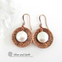 Artisan handcrafted copper earrings with a feminine, elegant style accented with white freshwater coin shaped pearls. Perfect for all occasions, they'll look great dressed up or down. Makes a great gift for couples celebrating their seventh wedding anniversary, as copper is the traditional choice for this occasion. 