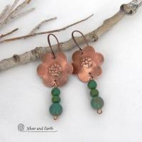 These hand forged copper flower earrings are accented with a stack of dangling turquoise stones. They have an earthy, whimsical charm and will make a great gift for nature / flower lovers and couples celebrating their seventh wedding anniversary. Copper is the traditional choice for this anniversary. Handmade in the USA by Silver and Earth Jewelry. 