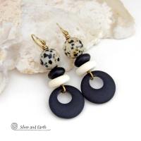 These handcrafted earrings feature matte black glass circle hoops accented with Dalmatian jasper gemstones, African bone and black glass beads. Unique and fun to wear, they have an earthy natural style with boho chic flair that makes a striking statement. They'll make a great gift for a natural stone lover - or a nice addition to your own jewelry wardrobe. 