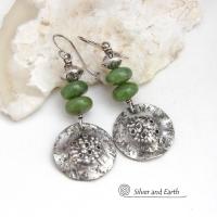 These handcrafted earrings feature textured sterling silver dangles accented with a stack of Canadian green jade gemstones topped off with silver pewter beads. The silver has a hammered rustic organic texture, along with a few holes that were added for a primal effect. They have an earthy, modern style that coordinates well with all wardrobe types. 