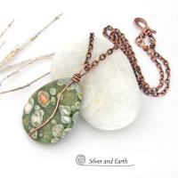 This pendant necklace is perfect for those that prefer a modern, simplistic and earthy style. It features a natural green rainforest jasper gemstone wrapped in copper wire on a textured and oxidized copper chain necklace. The stone has a beautiful natural matrix pattern in earthy hues of green with orbs of white inclusions and a touch of orange. 
