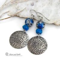 These handcrafted sterling silver earrings have a rustic, hand stamped texture and are accented with natural K2 granite and faceted blue apatite gemstones. This unique, interesting stone has beautiful blue azurite inclusions within a black and white speckled granite base. It was discovered in the foothills of world's second highest mountain, Mount K2, which it's name is derived from. The blue apatite was added to bring out the gorgeous blue inclusions in these stones. 