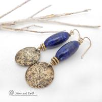 These handcrafted earrings feature beautiful long tube-shaped lapis lazuli gemstones accented with hammered gold brass dangles and tiny brass beads. The stones are a beautiful rich shade of blue with a sprinkling of natural sparkly pyrite inclusions. They have a modern, earthy chic elegance and can be worn with a variety of outfits - dressed up or down. Silver and Earth is a small business that makes beautiful handmade jewelry with high-quality natural materials. 