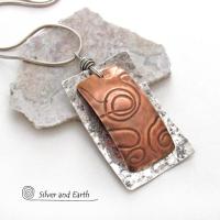 This unique mixed metal necklace has a contemporary, modern design. It features uniquely textured copper framed against a background of lightly hammered sterling silver. The combination of metals can easily mix and match with other copper and silver accessories in your wardrobe. Bold and striking, it's a one of a kind piece!