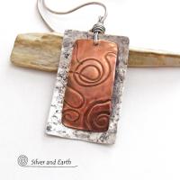This unique mixed metal necklace has a contemporary, modern design. It features uniquely textured copper framed against a background of lightly hammered sterling silver. The combination of metals can easily mix and match with other copper and silver accessories in your wardrobe. Bold and striking, it's a one of a kind piece!