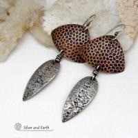 These sterling silver and copper mixed metal earrings have a modern, contemporary vibe. The copper has a dotted embossed pattern and the sterling dangles have a rustic hammered and stamped texture. Unique and versatile, the combination of metals will coordinate well with other copper and silver accessories in your wardrobe.