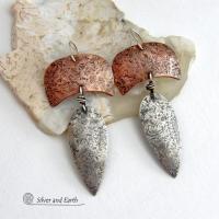 These handcrafted sterling silver and copper mixed metal earrings have an earthy, organic style with a modern tribal vibe. Unique and versatile, the combination of metals enables them to mix and match with other copper and silver accessories in your wardrobe. Handmade in the USA by Silver and Earth Jewelry.